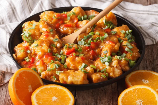 Tasty orange chicken closeup on a plate. Horizontal — Stock Photo, Image
